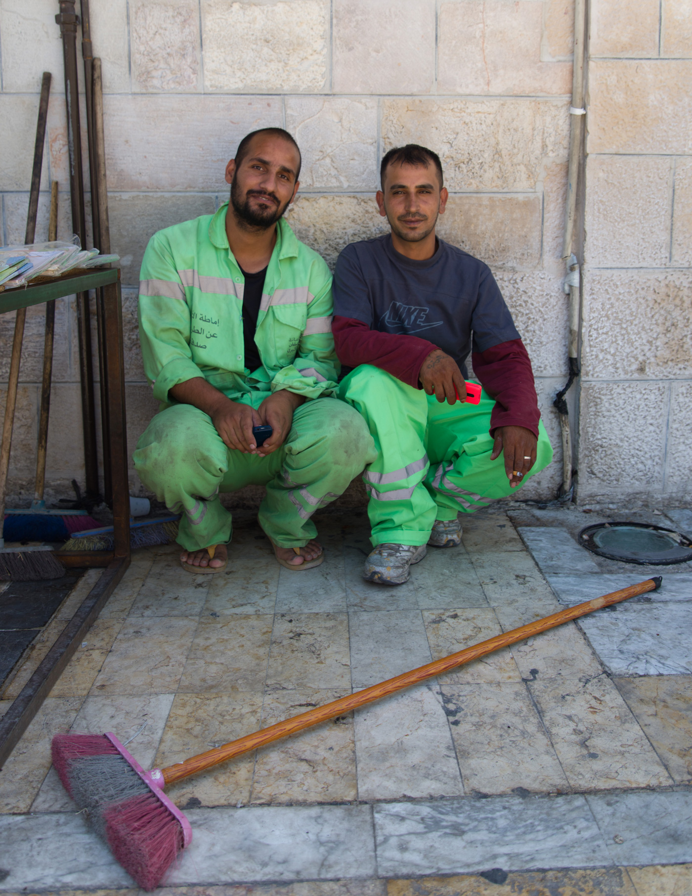 Cleaners in Amman outside the Grand Husseini Mosque. Some Jordanians say they would prefer to steal than clean streets.