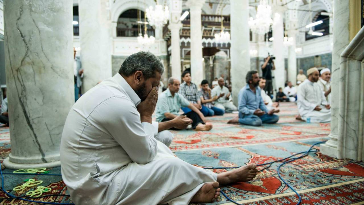 A man crying during an emotional Dua (prayer) by the Imam on the targeting of Sufis and their places of worship in Tripoli and around the city.